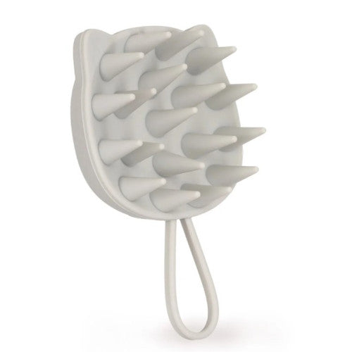 A light grey silicone grooming brush for humans with long conical bristles and a loop handle