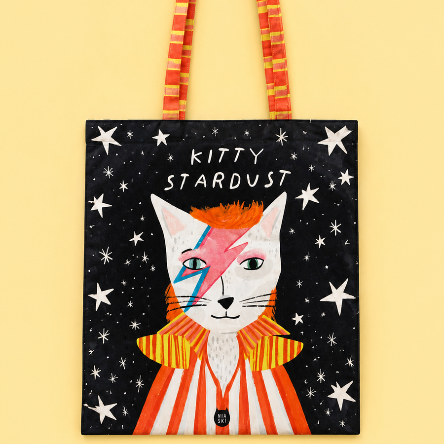 A tote bag featuring a stylised cat illustration inspired by David Bowie's 'The Rise and Fall of Zigzag' with the text 'KITTY STARDUST' 