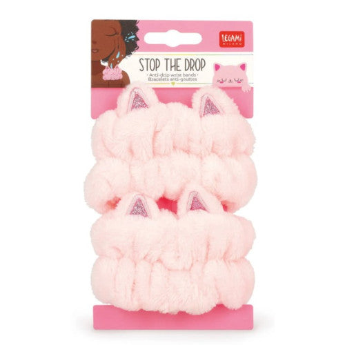 Pack of two fluffy pink cat-ear wrist bands on a pink retail card