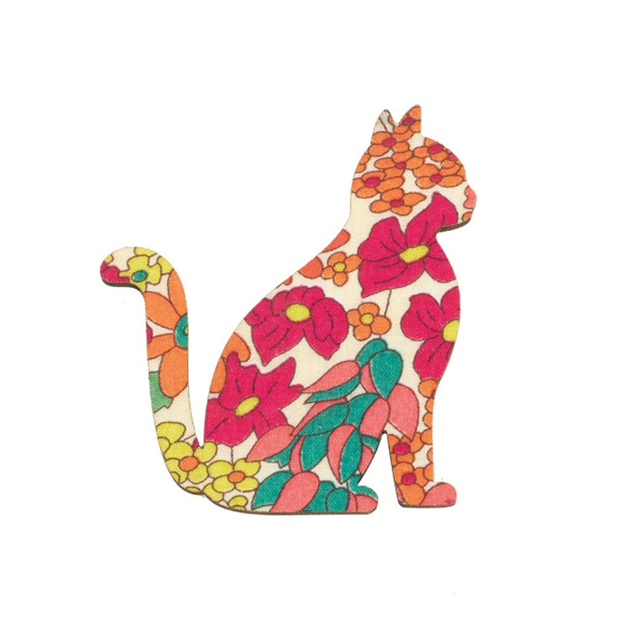 Colourful floral-patterned cat-shaped object on a white background