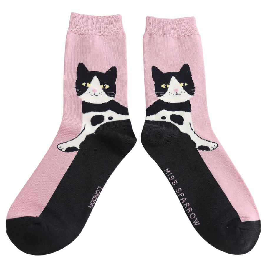 A Pair of pink and black socks. Tuxedo Cats with yellow eyes design. 