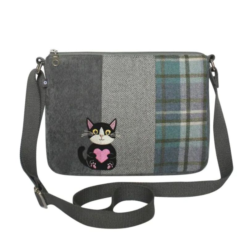 A plaid and herringbone rectangular crossbody bag featuring an embroidered black-and-white cat holding a pink heart