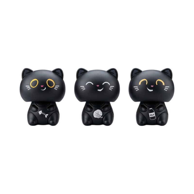 Three black cat-shaped figurines with yellow eyes and white facial details, each holding a small object, shown on a plain white background.