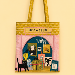 A fabric tote bag featuring a whimsical illustration of a cat-themed art gallery named 'MEOWSEUM'