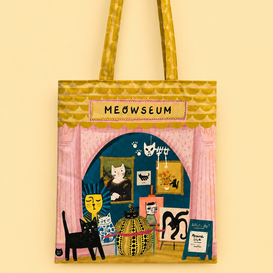 A fabric tote bag featuring a whimsical illustration of a cat-themed art gallery named 'MEOWSEUM'