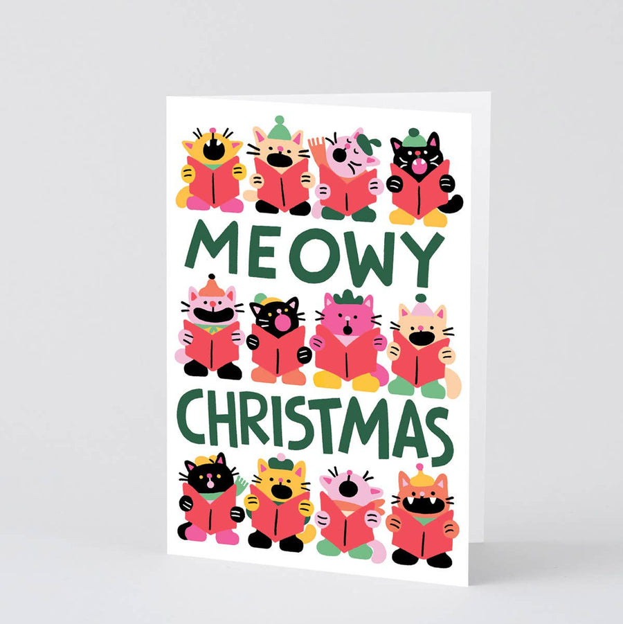 A white greeting card featuring a colourful illustration of cartoon cats in winter clothing, with the words 'MEOWY CHRISTMAS' 