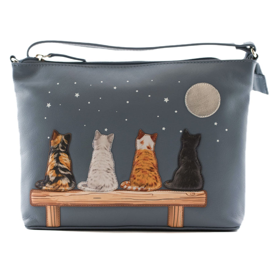 Grey cross body bag with four cats on a bench and starry sky design on a white background