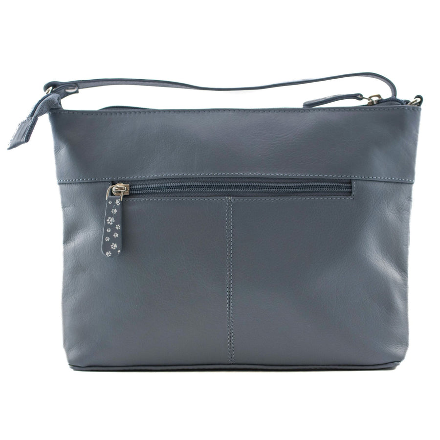 Denim blue handbag with a zipper on a white background