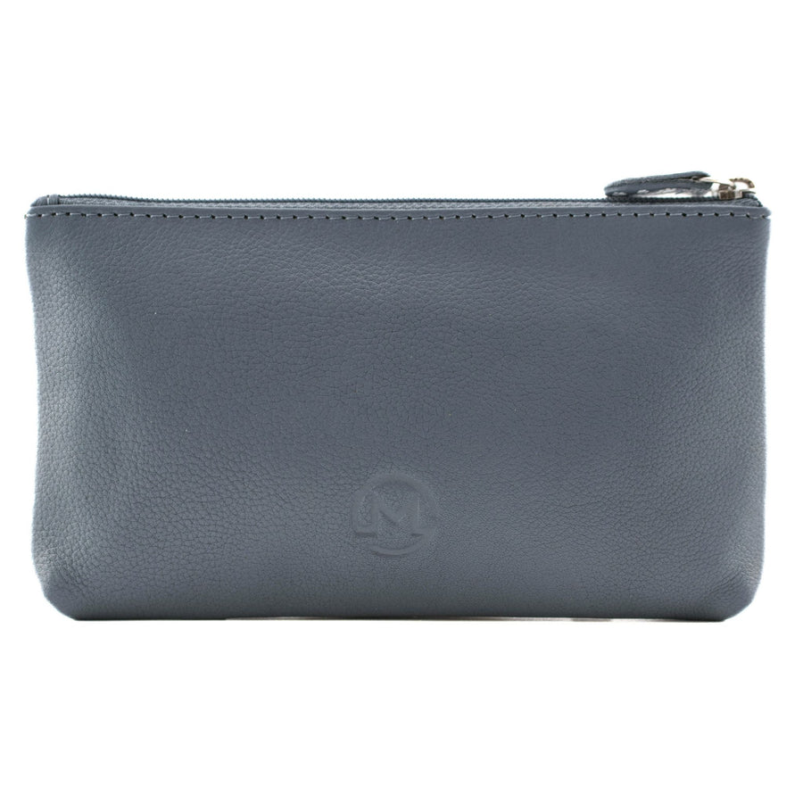 A rectangular pebbled leather zip pouch in a muted slate blue-grey color, featuring a debossed circular 'M' logo on the front.