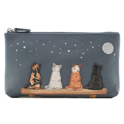 A slate blue pebbled leather zip pouch featuring four embroidered cats sitting on a bench under a starry night sky. 