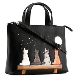 Black leather grab handbag with strap featuring four applique cats on a bench under a moonlit starry sky