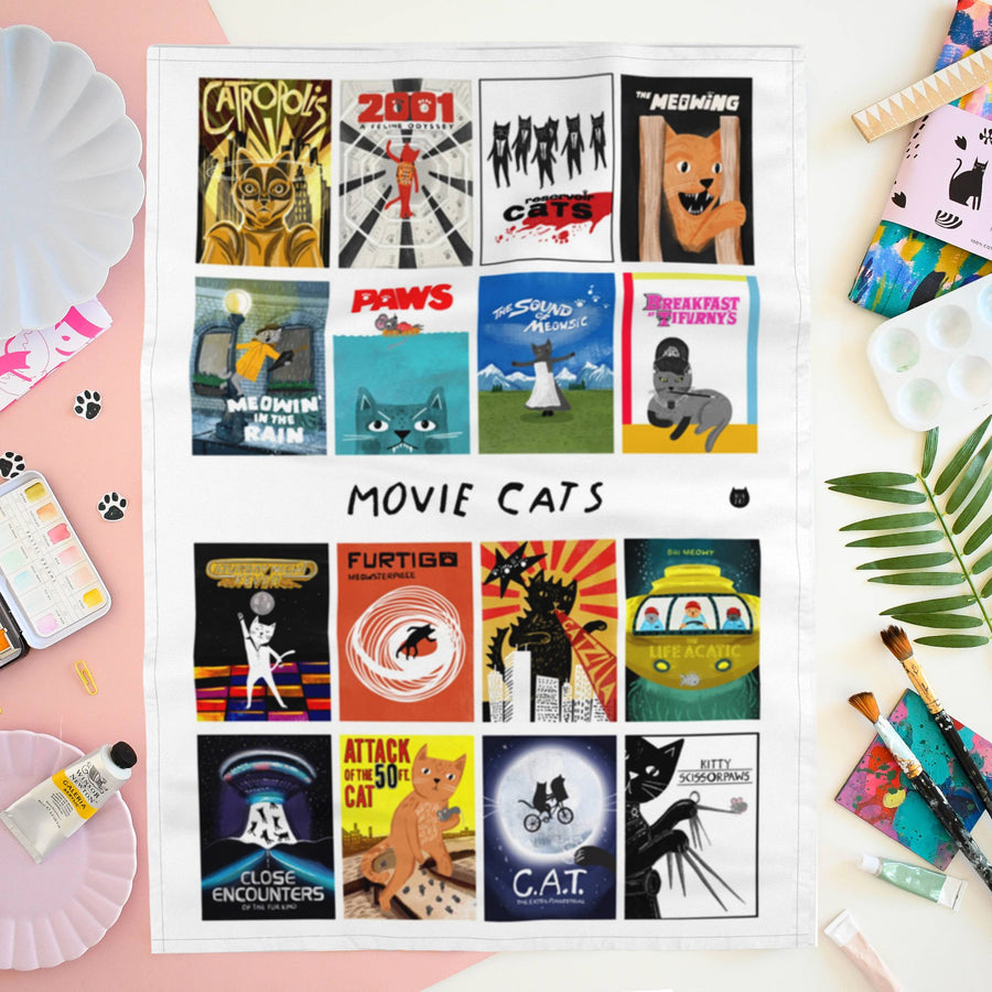 A white fabric print featuring a grid of 16 movie poster illustrations with the text 'MOVIE CATS'