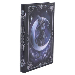 Decorative notebook with a witch and moon design on a white background