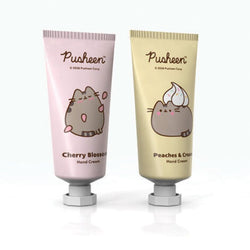 Two tubes of Pusheen hand cream, one cherry blossom and one peaches & cream, on a white background.