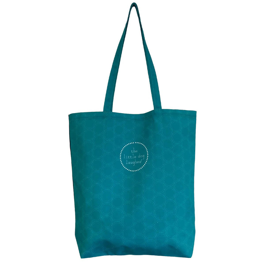Teal tote bag with a circular logo on a white background