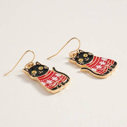 Cat-shaped earrings with red and gold patterns on a light grey background
