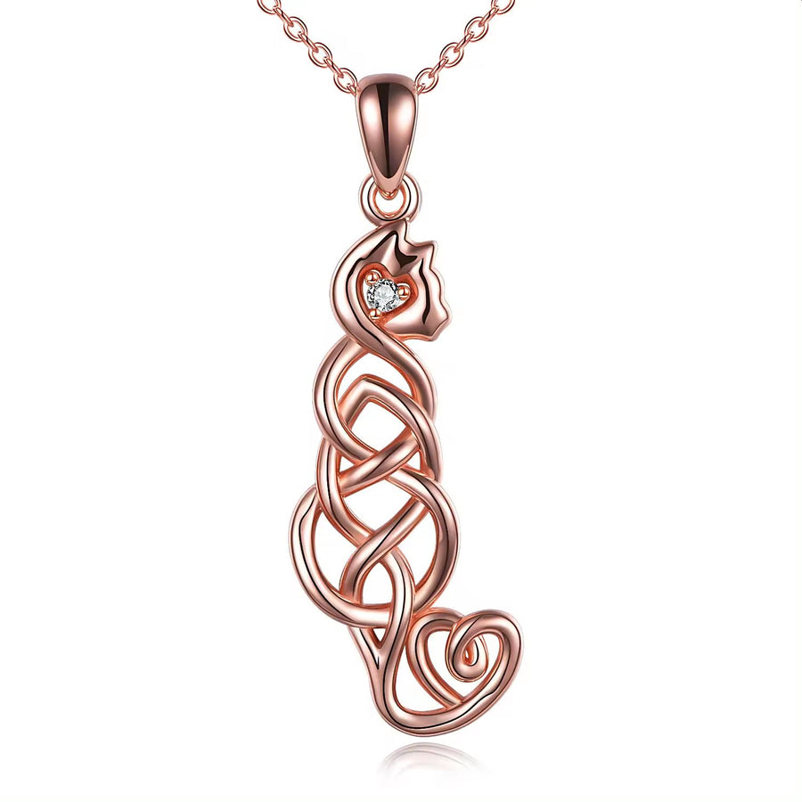 A rose gold plated sterling silver cat pendant with a heart-shaped crystal on a chain