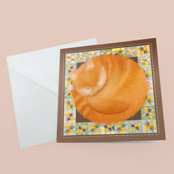 A square greeting card featuring an illustration of a curled-up orange tabby cat inside a geometric multicolour border