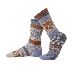 Pair of cat patterned socks with brown and blue accents on a white background