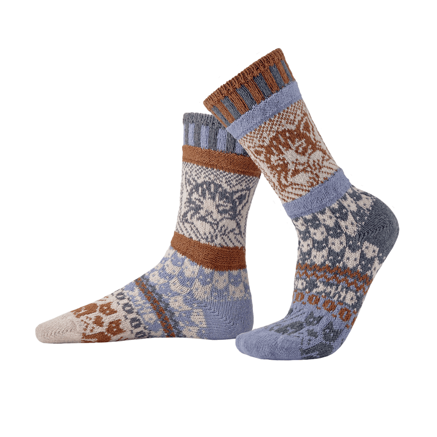Pair of cat patterned socks with brown and blue accents on a white background