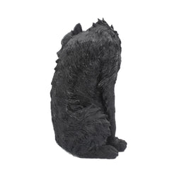 Side view of Spite Black Cat resin ornament on a white background