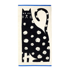 Towel with a white spotted black cat design on a white background