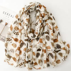 Lightweight Scarf in browns and cream with cat pattern on a white background