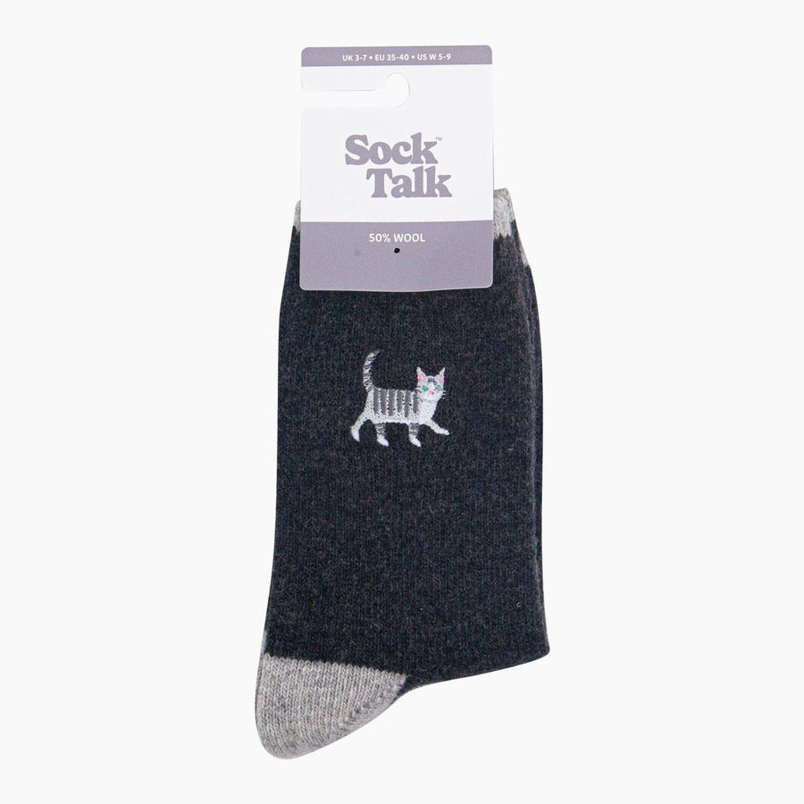 A single dark charcoal gray sock with a light gray toe and heel, featuring a white and grey cat graphic on the side.