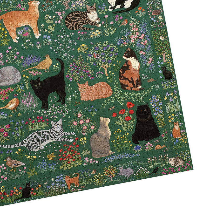 Woven mat with cats and nature design on a green background