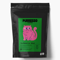 A black stand-up coffee bag with a green label featuring a pink cat illustration and text 'PURRESSO COFFEE' and 'The House Cat - Blend'