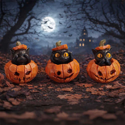 Three pumpkin cat figurines with carved faces on a dark, leaf-covered ground with a spooky background.