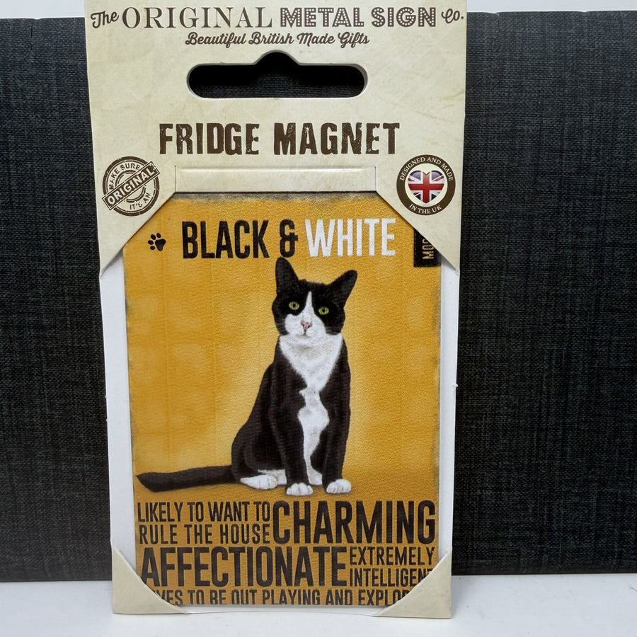 A packaged fridge magnet featuring a black and white cat illustration on a mustard yellow background. The card reads 'FRIDGE MAGNET' and 'BLACK & WHITE' 