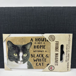 A fridge magnet package featuring a black and white cat illustration and the text 'A HOUSE IS NOT A HOME WITHOUT A BLACK & WHITE CAT'