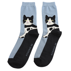 A pair of crew socks with a light blue upper and black lower section, featuring a black-and-white cat illustration