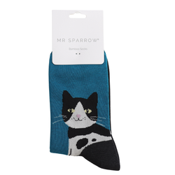 A pair of MR SPARROW bamboo socks featuring a black and white tuxedo cat design on a teal blue background