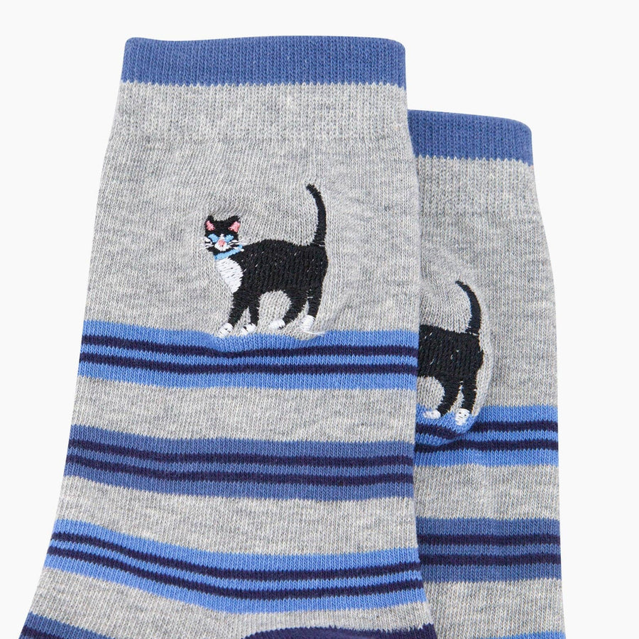 Grey socks with blue stripes and black cat design on a white background