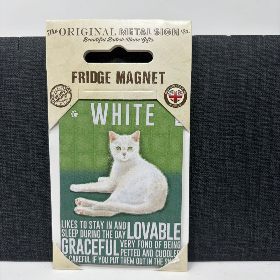 A packaged fridge magnet by The Original Metal Sign Co. The magnet is labeled 'WHITE' with a photo of a white cat on a green background