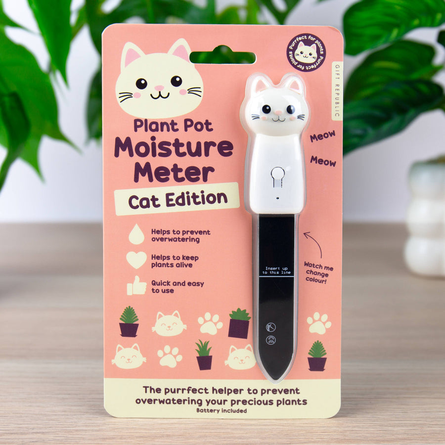 Plant pot moisture meter with pink packaging featuring a cat design on a wooden surface