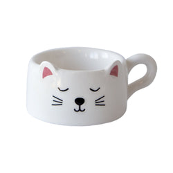 A white ceramic cat-face tealight with handle and pink inner ears