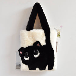 Black and white cat-shaped plush bag on a light gray background