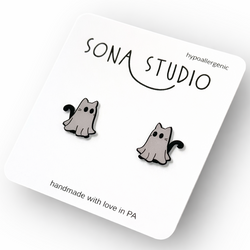Cat-shaped earrings on a Sona Studio card with 'hypoallergenic' text.