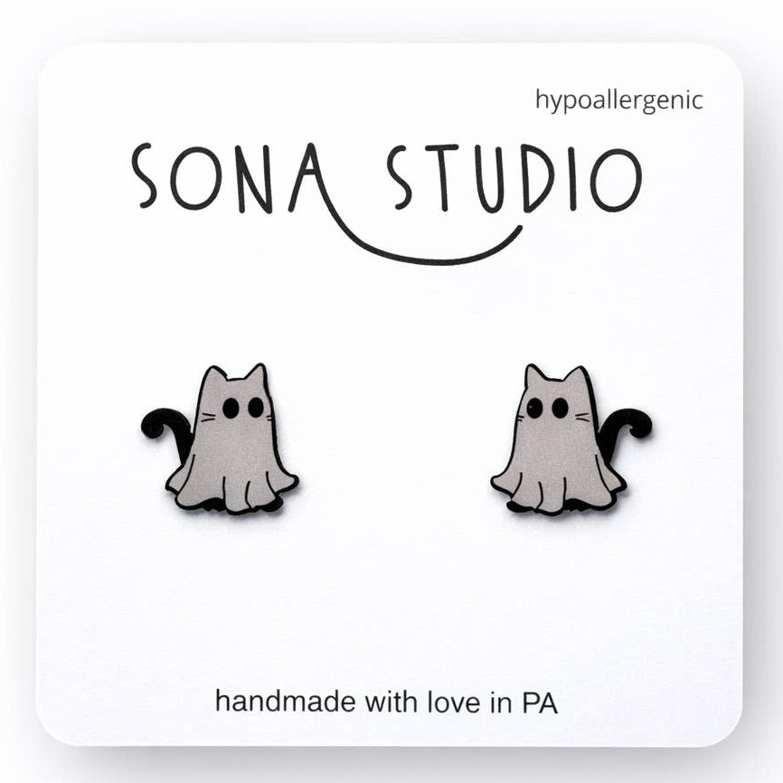 Cat-shaped earrings on a white card with 'Sona Studio' branding.