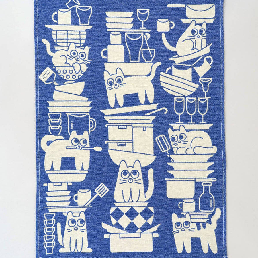 Blue towel with white cat illustrations on a white background