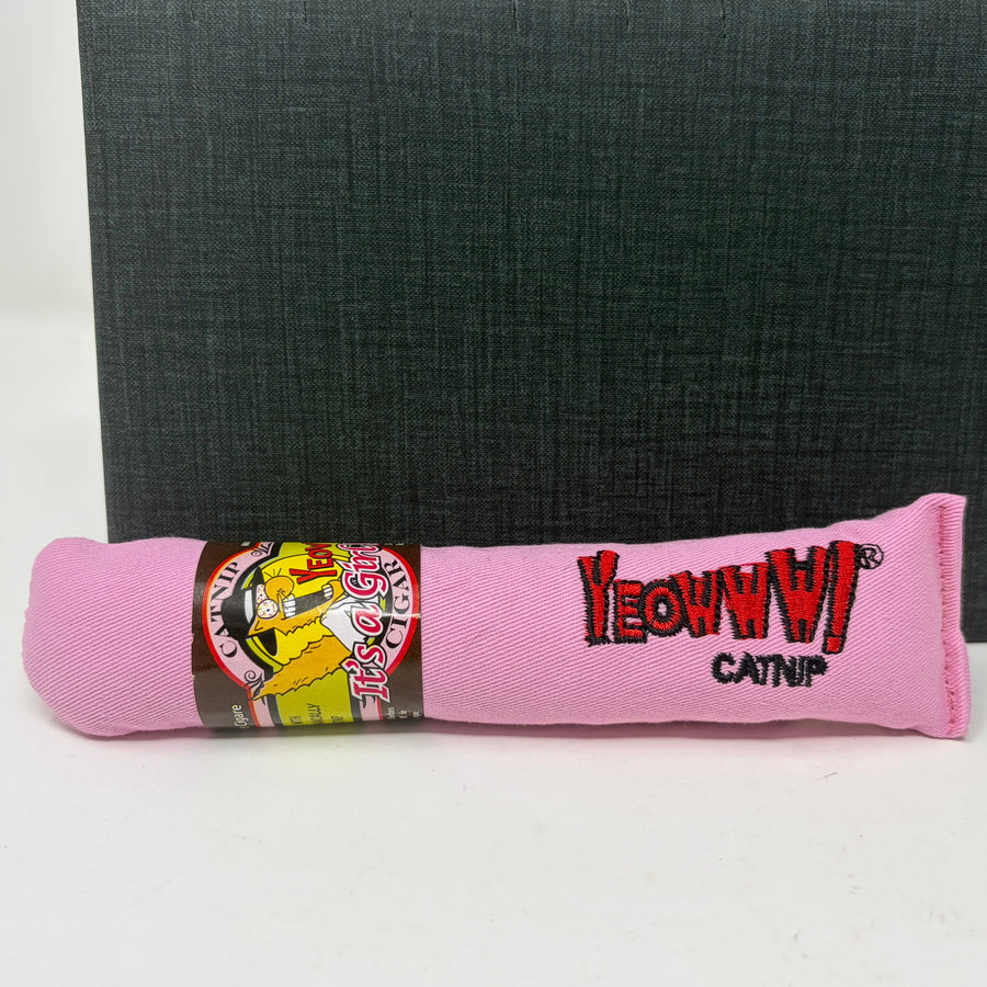 A pink fabric catnip toy cigar with embroidered 'YeowwW catnip' text and a cartoon cat graphic