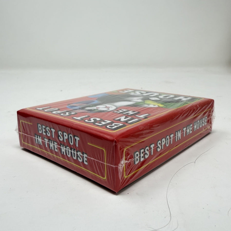 A red deck box for 'Best Spot in the House' playing cards, wrapped in clear plastic, photographed on a light gray background.