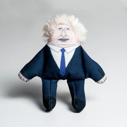 Sewn catnip toy of man in a suit and tie with scruffy hair, resembling boris johnson