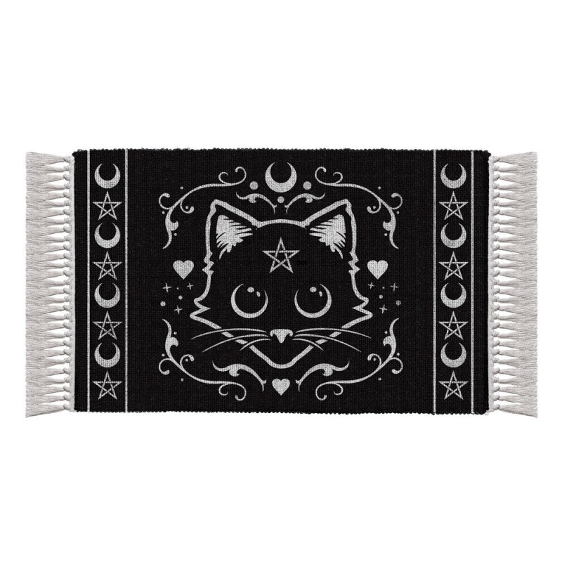 Black rug with white tassels with mystical white cat motif featuring pentagram stars and moons